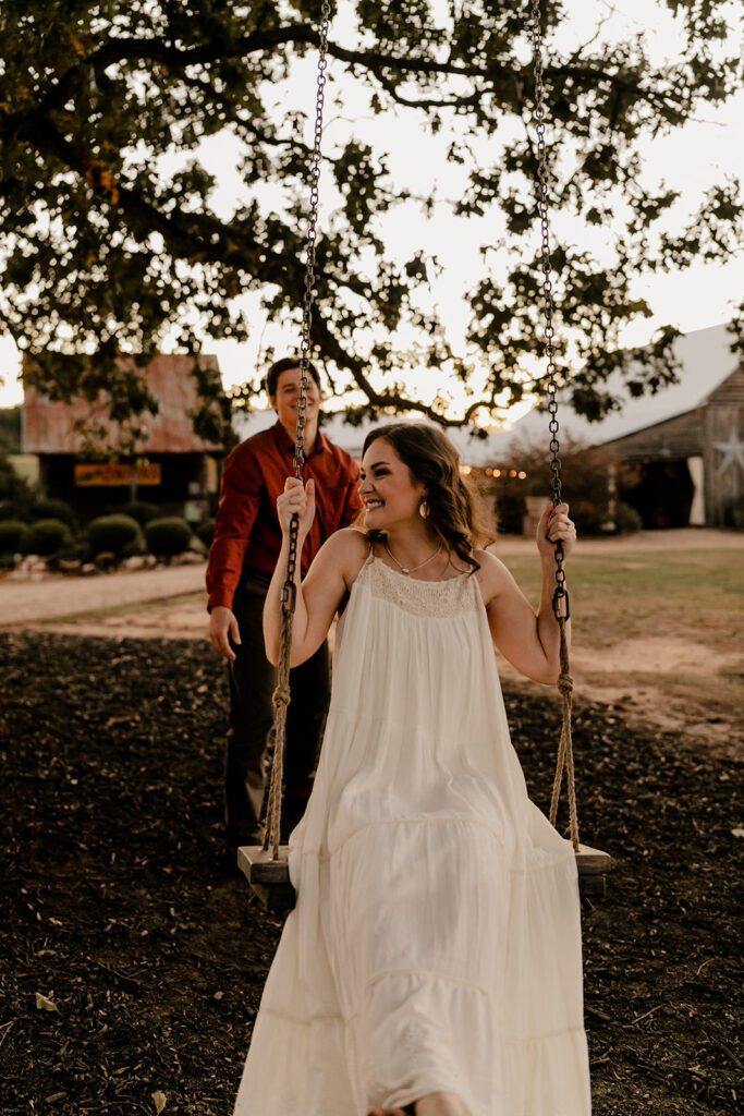 Jake and Keaton enjoying the rope swing during their engagement session at West Milford Farm.