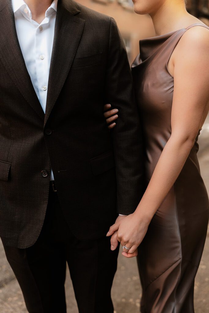 Detail shot of engaged couple holding hands during West Village engagement session in NYC

