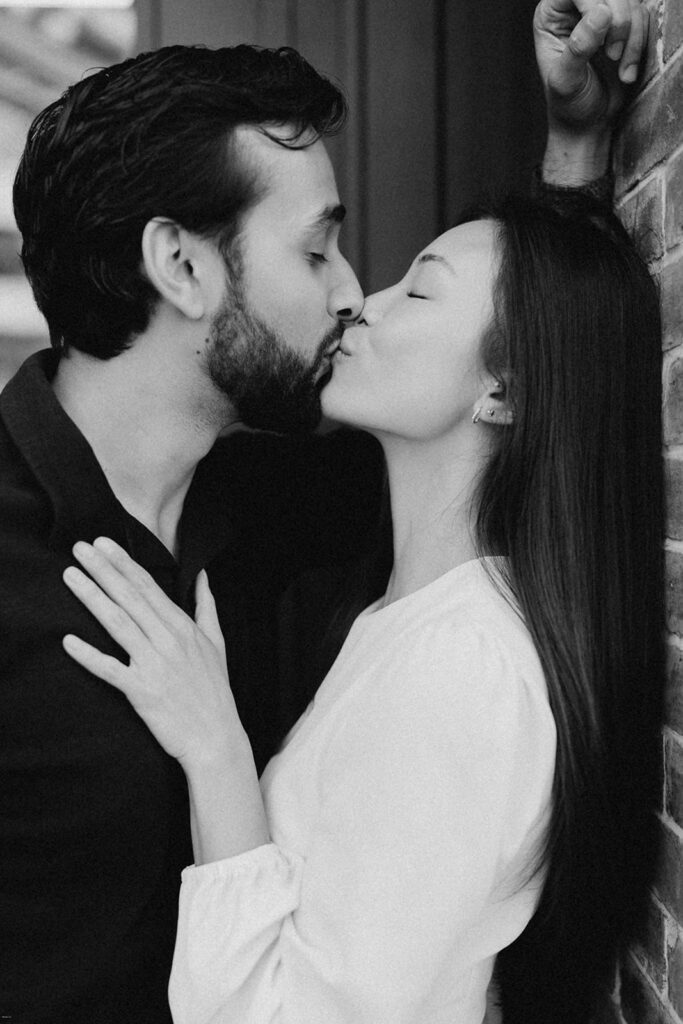 Close-up of engaged couple sharing a kiss during editorial-style engagement session in Chelsea NYC

