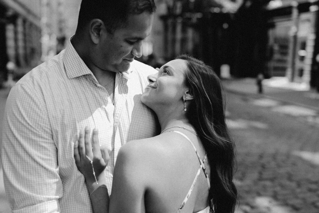 Black-and-white close-up of engaged couple gazing at each other during SoHo NYC engagement session

